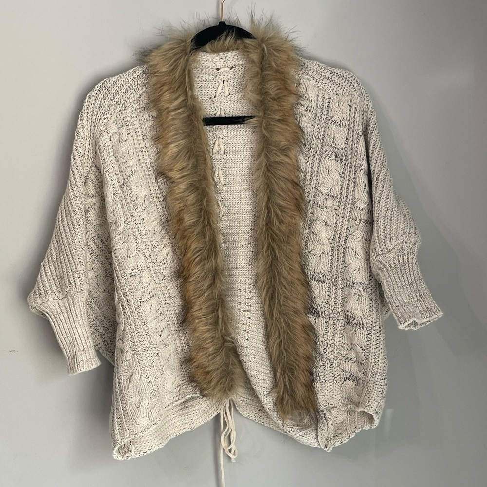 Cream colored knitted open front cardigan with faux fur trim & lace up back; M